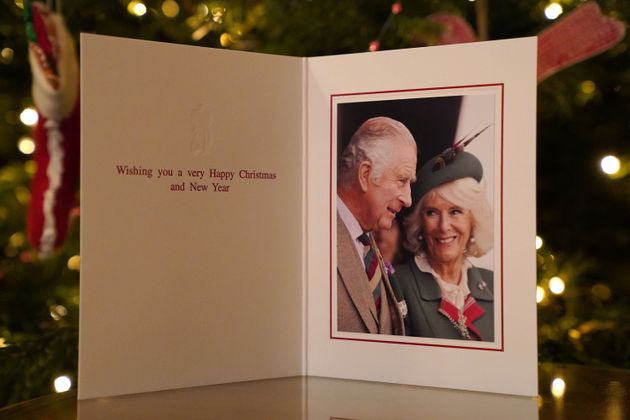 The 2022 Christmas card of King Charles III and the Queen Consort in front of a Christmas tree in Clarence House. The card's photograph was taken at the Braemar Games on Sep 3. by Samir Hussein. 